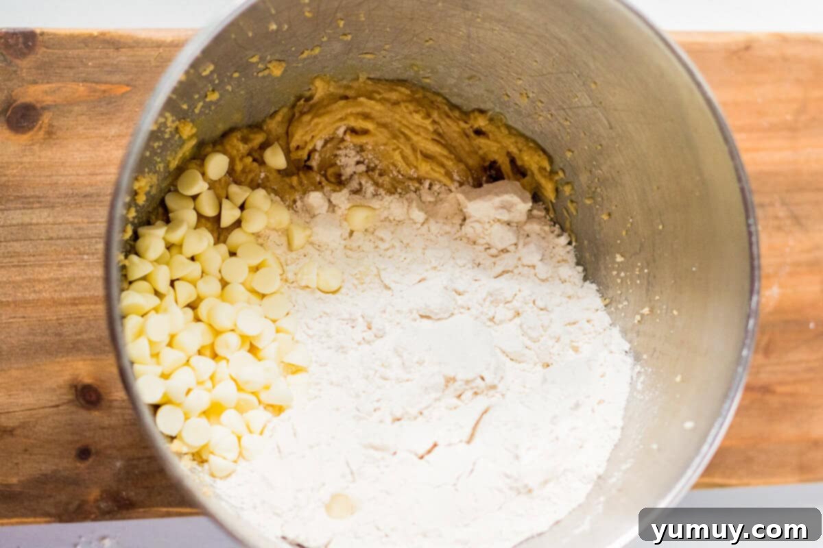 Cookie dough ingredients in a mixing bowl before coloring.