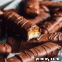 A featured image of homemade Twix bars, perfectly layered and chocolate-coated, ready to be enjoyed.