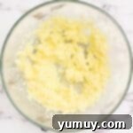 Creamed butter and sugar showing a light and airy texture, a crucial step for the shortbread base.