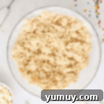 crumbly cookie dough in a glass bowl.