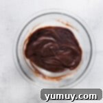 Melting chocolate with heavy cream for cheesecake filling