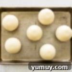 Sealing hot cocoa bomb halves together using a warm skillet.