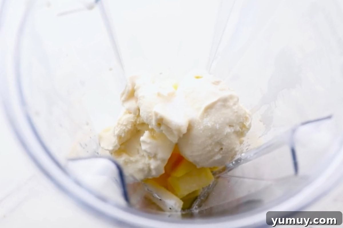 Pineapple Soft Serve Delight 5 ingredients for dole whip in a blender.