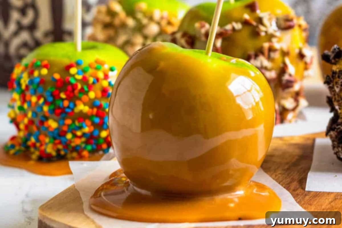 Perfectly hardened and decorated caramel apples, ready for serving after chilling.