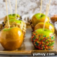 Featured caramel apples, glossy and perfectly coated.