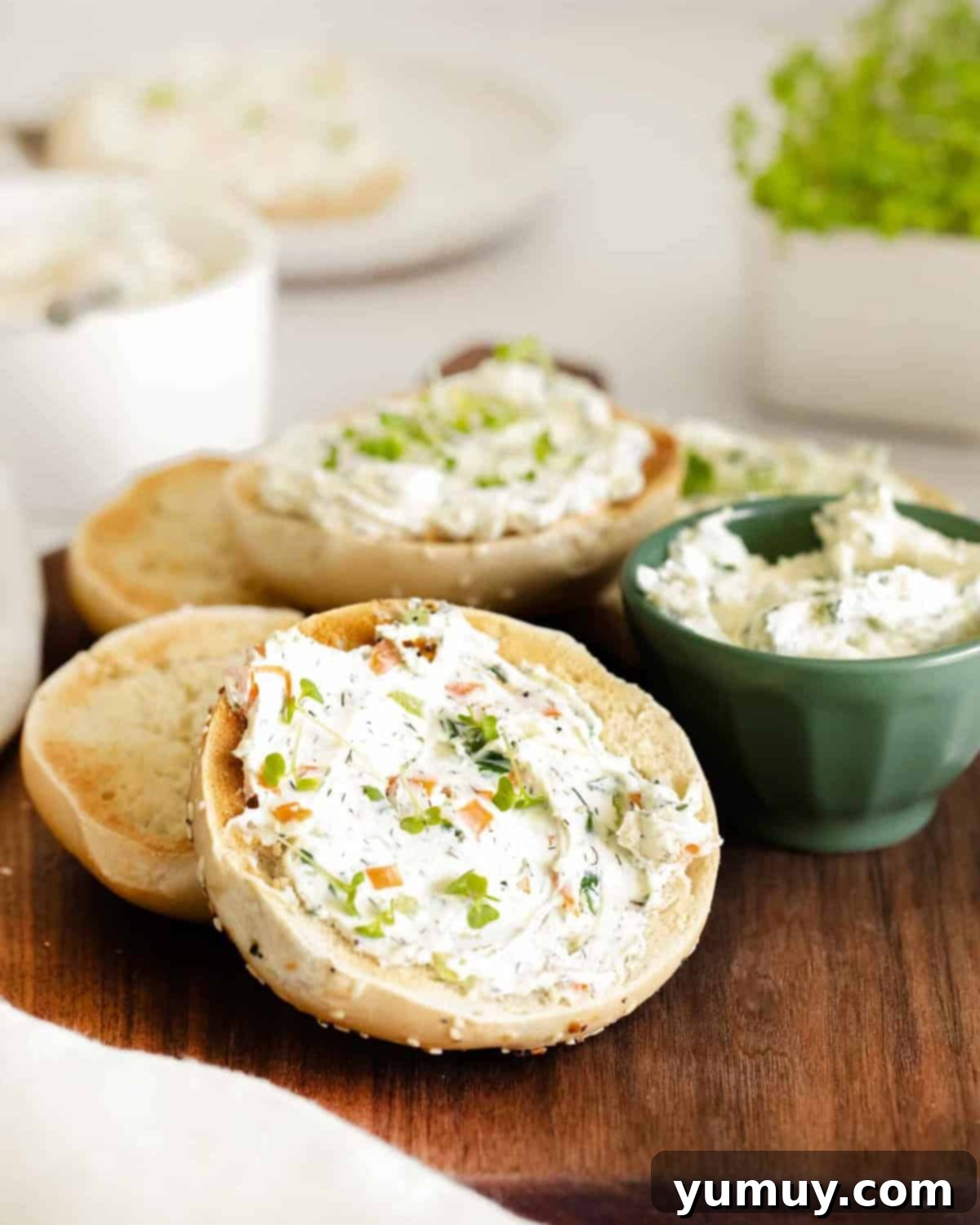 Flavored Cream Cheese: Triple the Deliciousness 2 Veggie flavored cream cheese spread on sliced bagels.