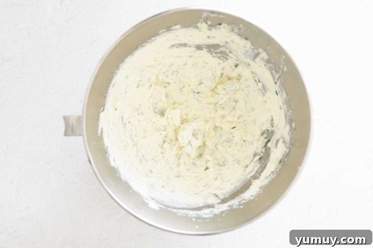 Flavored Cream Cheese: Triple the Deliciousness 10 Garlic and herb cream cheese in the bowl of a stand mixer.