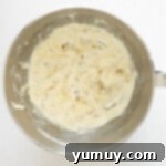 Flavored Cream Cheese: Triple the Deliciousness 5 flavored cream cheese in a stainless mixing bowl.